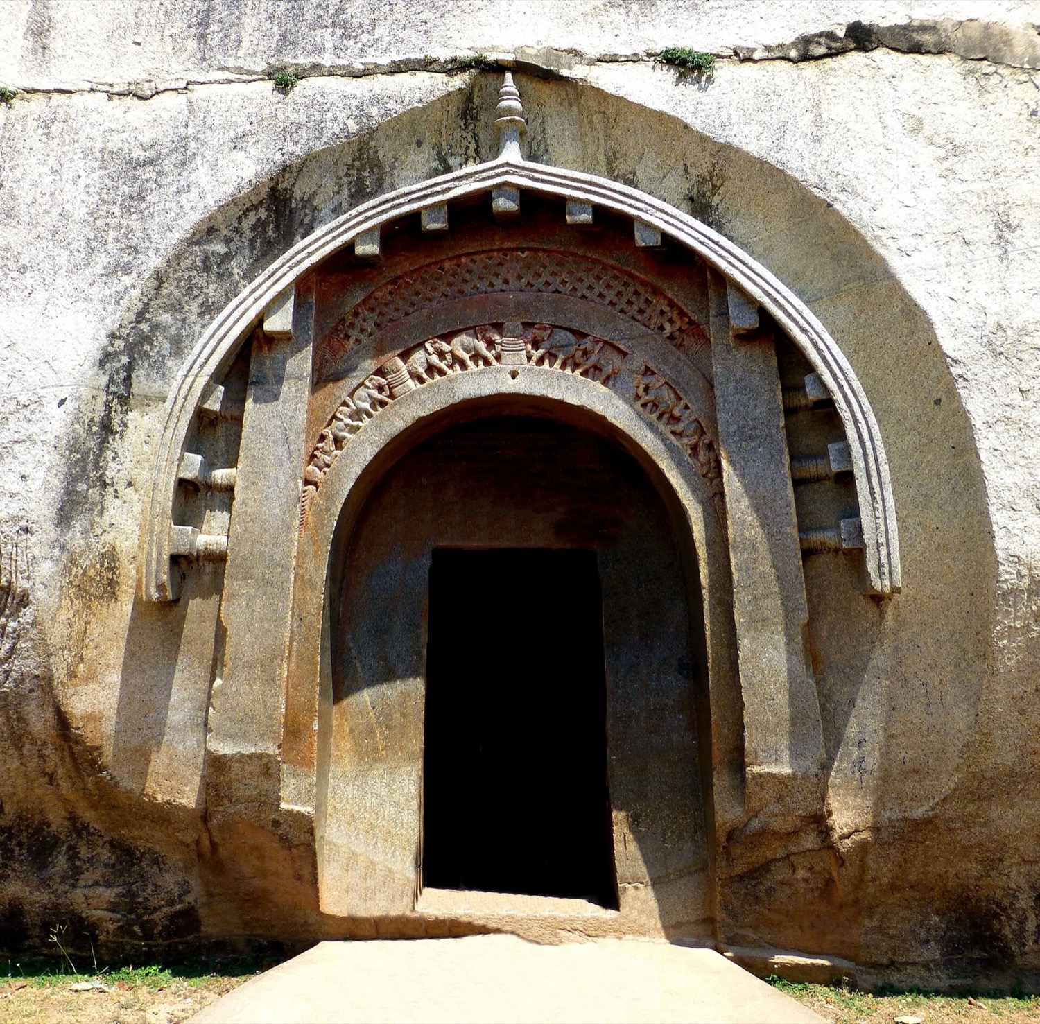 Polished granite entrance to a rock-cut cave in the Barabar Hills