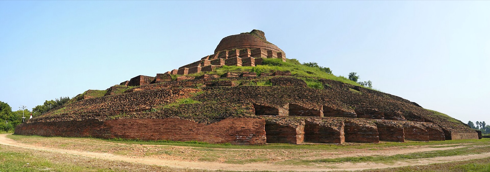 Massive terraced brick mound of the Kesaria Stupa rising from the plains