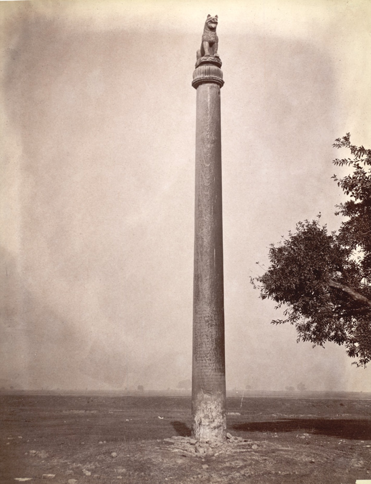 Polished sandstone Ashokan pillar with a seated lion capital at Lauriya Nandangarh