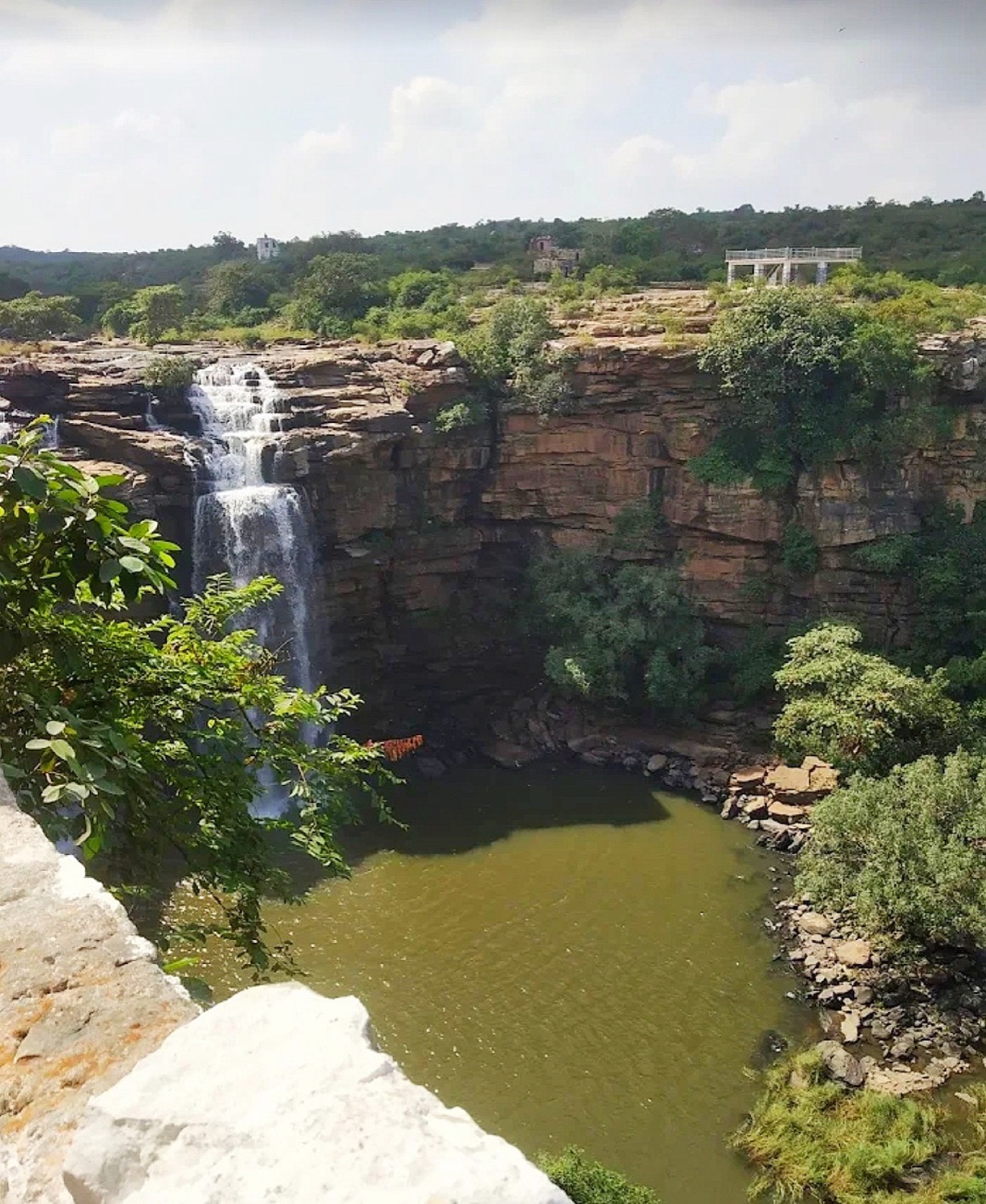 Manjhar Kund waterfall pouring into a rocky pool in the Kaimur Range near Sasaram
