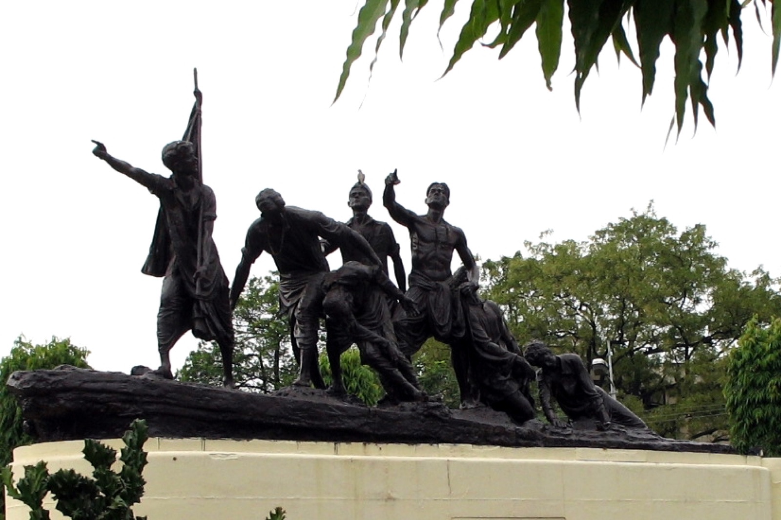 Bronze statues of the seven young martyrs holding the national flag at Shaheed Smarak, Patna